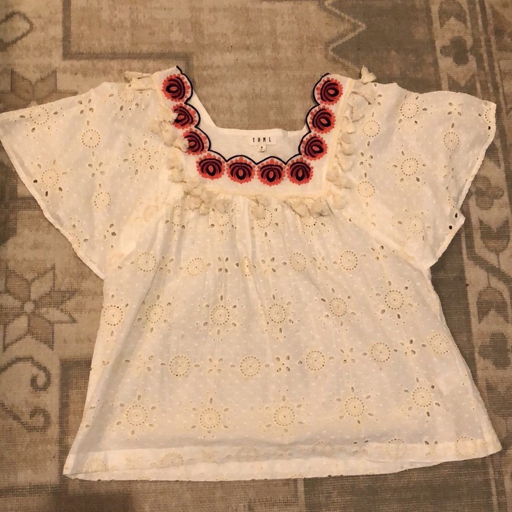 Eyelet top with tassel & embroidered details